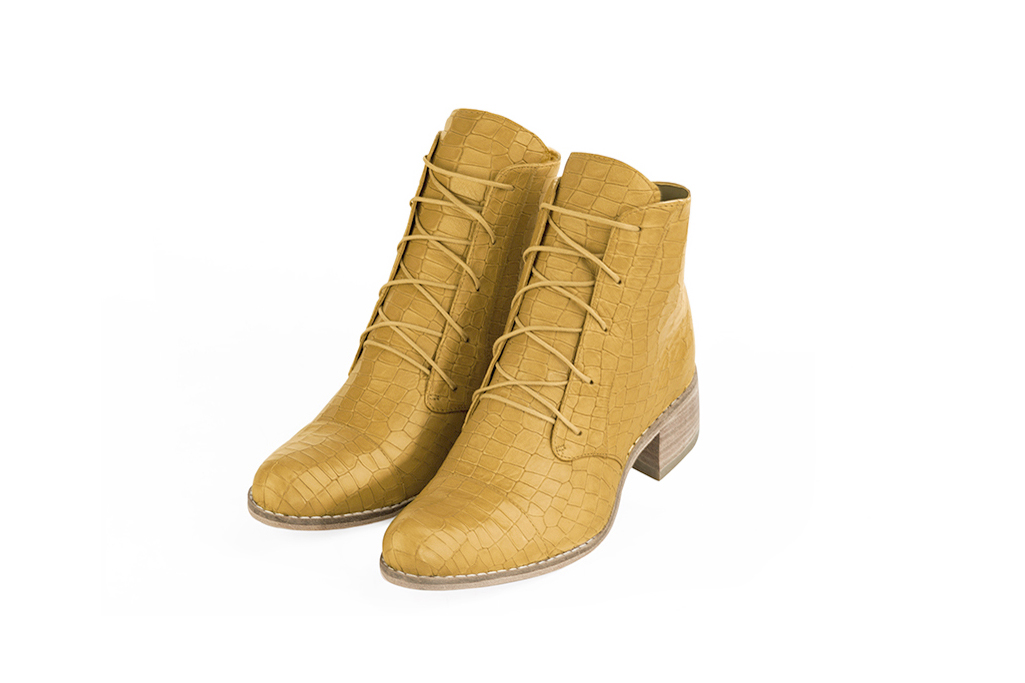 Mustard yellow women's ankle boots with laces at the front. Round toe. Low leather soles. Front view - Florence KOOIJMAN